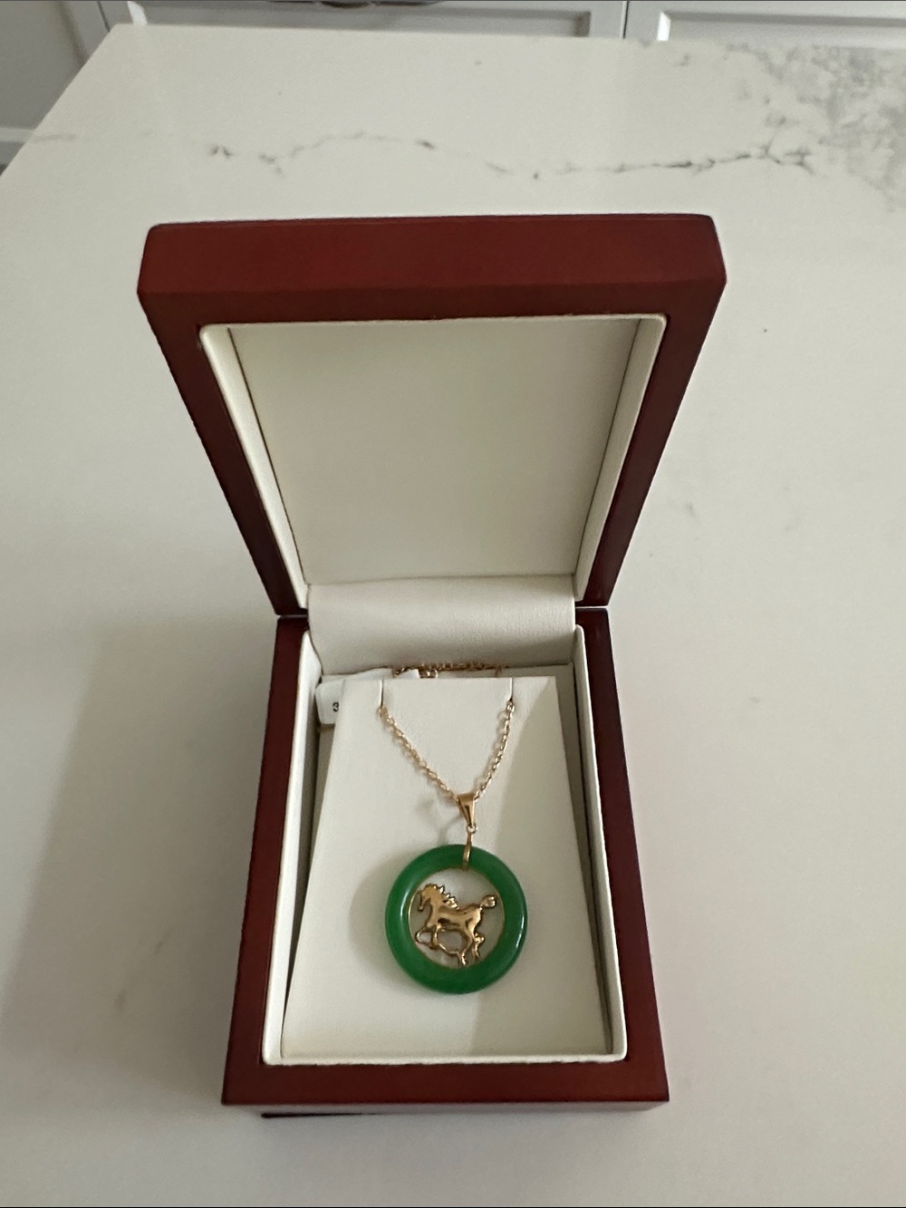 14kt yellow gold and jade horse pendent